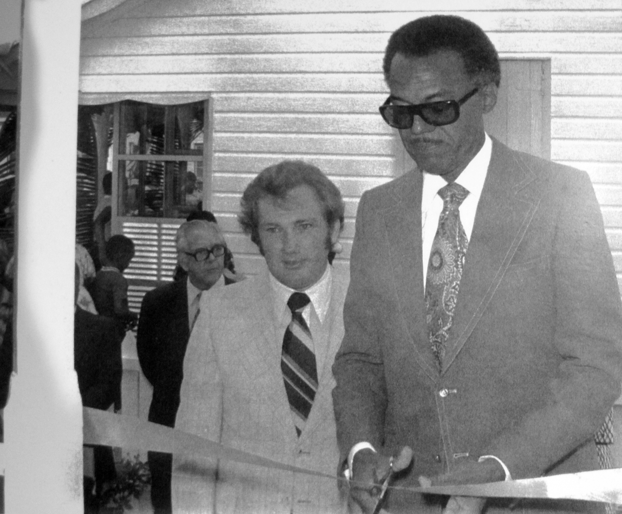 Sir Clement Maynard cuts the ribbon formally opening Green Turtle Cay's Albert Lowe Museum. 